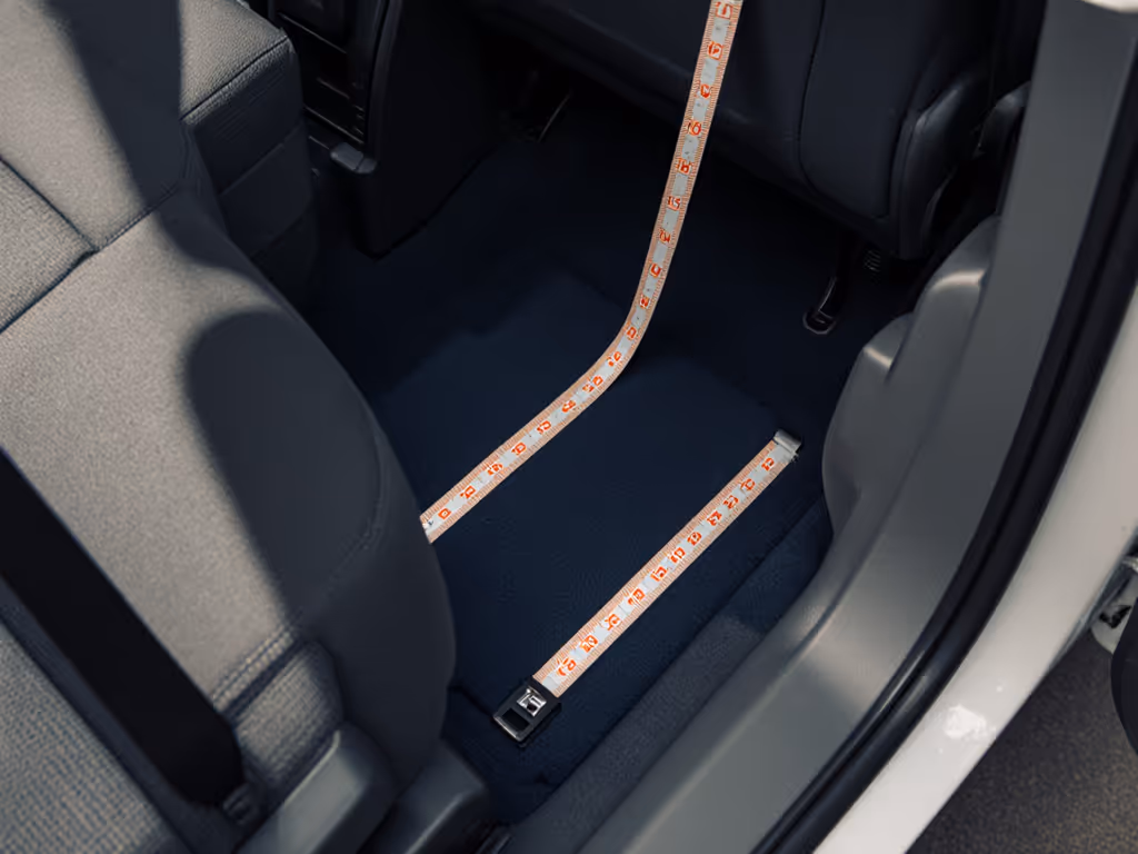 Compact car backseat with measuring tape